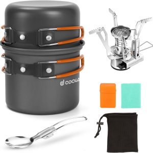 Odoland 6-piece camping cookware mess kit with pot, stove, spork, and mesh bag on a forest floor