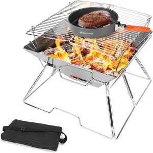 Odoland Folding Campfire Grill set up over a campfire with steaks cooking